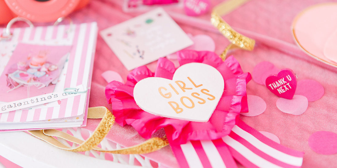 Galentine's Day Party Table covered in pink heart crafts.