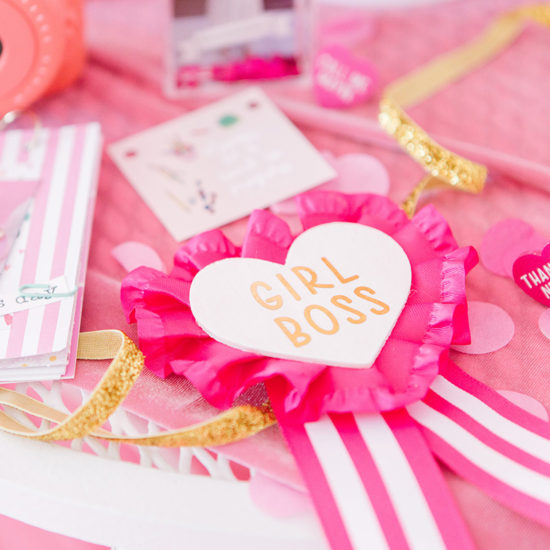 Galentine's Day Party Table covered in pink heart crafts.