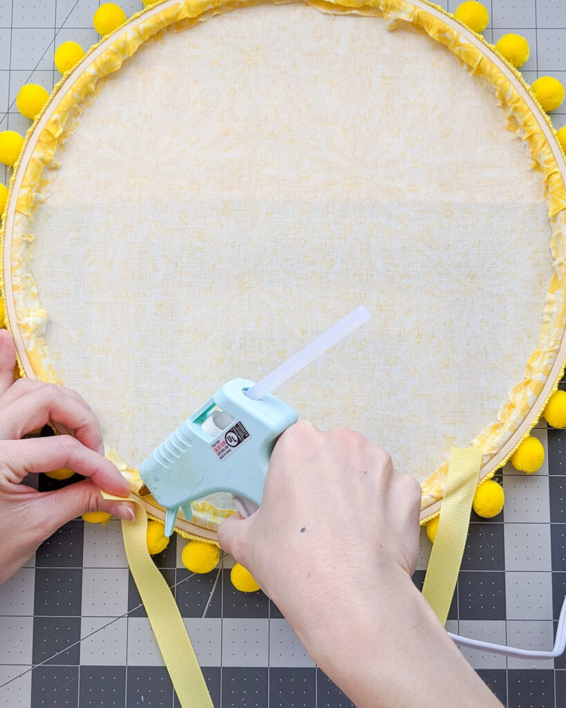 Hot gluing ribbon for hanging sunshine wreath