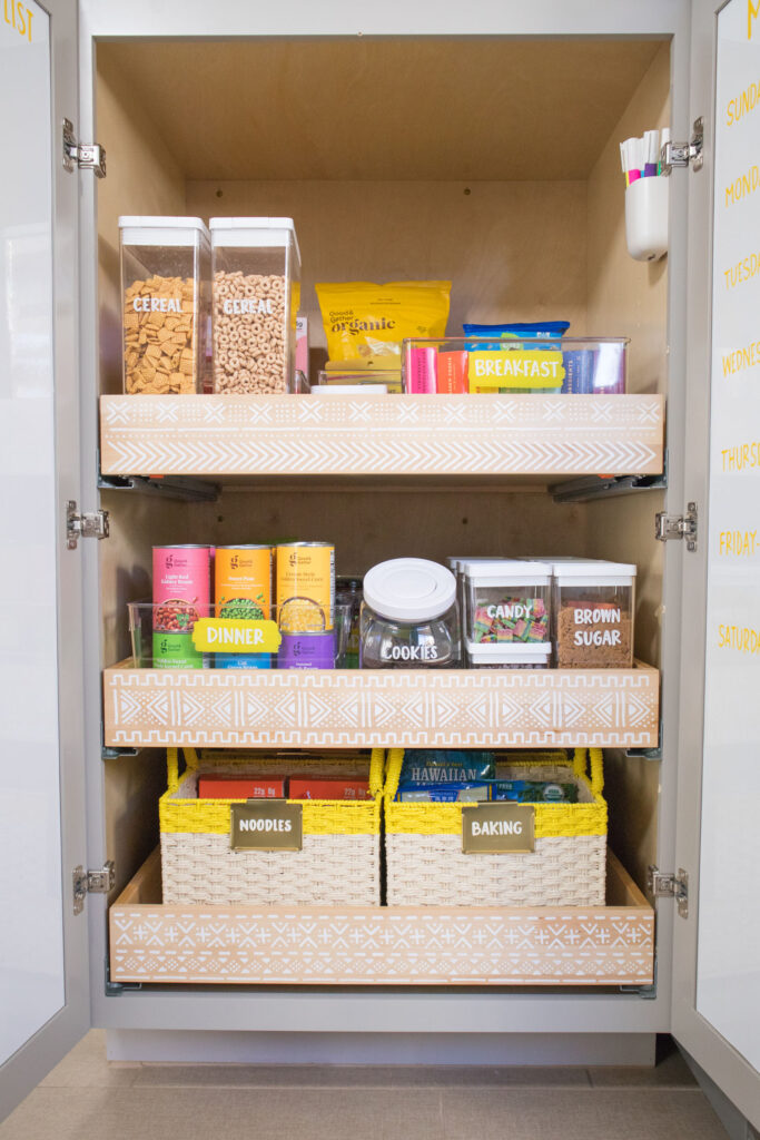 Finished pantry organization makeover. View of Blaire's bottom pantry cabinet.